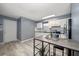 Bright kitchen with white cabinets, stainless steel appliances, and a stylish bar area at 15623 Morgan St, Clearwater, FL 33760