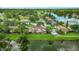Beautiful aerial view of a lakeside community with lush green landscaping at 15636 Morning Dr, Lutz, FL 33559