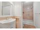 Bathroom with marble finishes in tub and vanity with a shower and bathtub at 15636 Morning Dr, Lutz, FL 33559