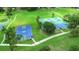 A scenic view of community tennis, pickleball, and basketball courts, inviting residents to enjoy an active lifestyle at 15636 Morning Dr, Lutz, FL 33559