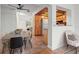 View of dining area featuring a modern table and access to kitchen and living room at 15636 Morning Dr, Lutz, FL 33559