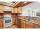 Well-equipped kitchen with stainless steel appliances, ample cabinetry, and granite countertops at 15636 Morning Dr, Lutz, FL 33559