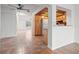 View of kitchen with a large refrigerator and view into the dining area and living room at 15636 Morning Dr, Lutz, FL 33559