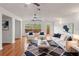 Inviting living room with hardwood floors, comfortable seating, and natural light, creating a relaxing and stylish space at 15636 Morning Dr, Lutz, FL 33559