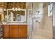 Bathroom with a wood vanity and a tiled glass enclosed shower at 15744 Crystal Waters Dr, Wimauma, FL 33598