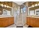 Bathroom featuring double sinks and a large glass enclosed shower at 15744 Crystal Waters Dr, Wimauma, FL 33598