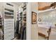 Walk-in closet next to the Primary bedroom includes shelving and drawers for optimal organization at 15744 Crystal Waters Dr, Wimauma, FL 33598