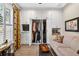 Convenient and spacious walk-in closet featuring custom shelving and storage, plus a flat-screen TV at 15744 Crystal Waters Dr, Wimauma, FL 33598