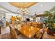 Dining room with a large table and chairs overlooking the kitchen at 15744 Crystal Waters Dr, Wimauma, FL 33598