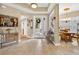 Bright foyer with tile floors, artwork, front door with glass, and furniture at 15744 Crystal Waters Dr, Wimauma, FL 33598