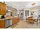Kitchen sink and dishwasher with dining area in view at 15744 Crystal Waters Dr, Wimauma, FL 33598