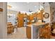 Kitchen area with island, breakfast table, stainless appliances and wood cabinets at 15744 Crystal Waters Dr, Wimauma, FL 33598