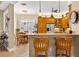 Kitchen area with island, breakfast table, stainless appliances and wood cabinets at 15744 Crystal Waters Dr, Wimauma, FL 33598