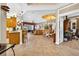 Open-concept living area with tile flooring, dining space, and views of the backyard at 15744 Crystal Waters Dr, Wimauma, FL 33598