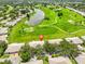 Aerial view of home, golf course and ponds in the community at 2417 Locksley St # 229, Sun City Center, FL 33573