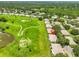 Aerial view of the property and golf course at 2417 Locksley St # 229, Sun City Center, FL 33573