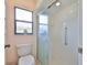 Clean bathroom with glass shower door and handicap grab bar at 2417 Locksley St # 229, Sun City Center, FL 33573