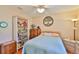 Bright bedroom with neutral walls, a window for light, and a bookcase at 2417 Locksley St # 229, Sun City Center, FL 33573