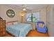 Cozy bedroom with neutral walls, a window for light, and a matching chair at 2417 Locksley St # 229, Sun City Center, FL 33573
