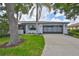 Charming single-story home with well-maintained landscaping and a spacious two-car garage at 2417 Locksley St # 229, Sun City Center, FL 33573