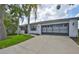 Charming single-story home with well-maintained landscaping and a spacious two-car garage at 2417 Locksley St # 229, Sun City Center, FL 33573
