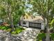 Charming single-story home with a well-maintained lawn, mature trees, and a two-car garage at 2417 Locksley St # 229, Sun City Center, FL 33573
