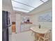 Open kitchen and breakfast nook area featuring updated appliances and countertops at 2417 Locksley St # 229, Sun City Center, FL 33573
