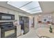 Charming kitchen with modern appliances, light cabinets, and a breakfast area at 2417 Locksley St # 229, Sun City Center, FL 33573