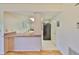Bright kitchen with a breakfast bar, white cabinets, and stainless steel appliances at 2417 Locksley St # 229, Sun City Center, FL 33573