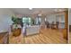 Spacious living room with hardwood floors, ceiling fan, and sliding doors to patio at 2417 Locksley St # 229, Sun City Center, FL 33573