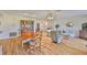 Spacious living room with hardwood floors, dining table, and traditional furniture at 2417 Locksley St # 229, Sun City Center, FL 33573