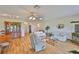 Bright living room featuring wood floors, comfortable seating, and elegant decor at 2417 Locksley St # 229, Sun City Center, FL 33573