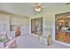 Relaxing sunroom with golf course views, built-in storage, and comfortable furniture at 2417 Locksley St # 229, Sun City Center, FL 33573