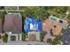 Unique home with a striking roof design surrounded by lush greenery and neighboring pools at 2650 W Bay Isle Se Dr, St Petersburg, FL 33705