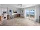 Living room with water views, sliding glass doors, and space for personalized design at 2650 W Bay Isle Se Dr, St Petersburg, FL 33705