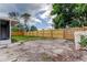 Large fenced backyard with ample space for outdoor activities at 3025 Palamore Dr, Holiday, FL 34691