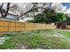Wide backyard with a new-looking wooden privacy fence for added security at 3025 Palamore Dr, Holiday, FL 34691