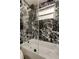 Modern bathroom showcasing a sleek glass-enclosed shower with elegant black marble tiles at 3025 Palamore Dr, Holiday, FL 34691