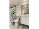 Contemporary bathroom with a walk-in shower, elegant marble tiling, and modern fixtures at 3025 Palamore Dr, Holiday, FL 34691