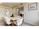 Dining room with modern table and chairs next to the open kitchen at 3025 Palamore Dr, Holiday, FL 34691