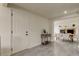 Bright entryway features gray tile flooring, a white front door, and flows into the dining area at 3025 Palamore Dr, Holiday, FL 34691