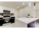 Bright kitchen with stainless steel appliances, black backsplash, and a breakfast bar island at 3025 Palamore Dr, Holiday, FL 34691