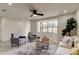 Bright living room featuring a large bay window, plush seating, and stylish decor at 3025 Palamore Dr, Holiday, FL 34691