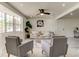 Bright living room featuring a large bay window, plush seating, and modern decor at 3025 Palamore Dr, Holiday, FL 34691