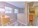 The hallway features wood flooring, natural light, and a view of the bedroom at 3110 Royal Tuscan Ln, Valrico, FL 33594