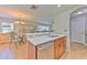 The open kitchen features stainless appliances, granite countertops, and a breakfast bar at 3110 Royal Tuscan Ln, Valrico, FL 33594
