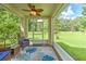 Relaxing screened-in patio offers a serene outdoor space with comfortable seating and scenic backyard views at 3110 Royal Tuscan Ln, Valrico, FL 33594