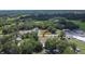 Wonderful aerial shot of a beautiful home nestled amongst mature trees and lush landscaping at 3212 Cork Rd, Plant City, FL 33565