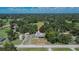 An aerial shot of a home surrounded by mature trees and lush green landscapes, providing a peaceful and secluded ambiance at 3212 Cork Rd, Plant City, FL 33565