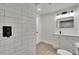 Bathroom with white subway tile shower and modern vanity at 3212 Cork Rd, Plant City, FL 33565